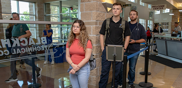 Students waiting in line on campus